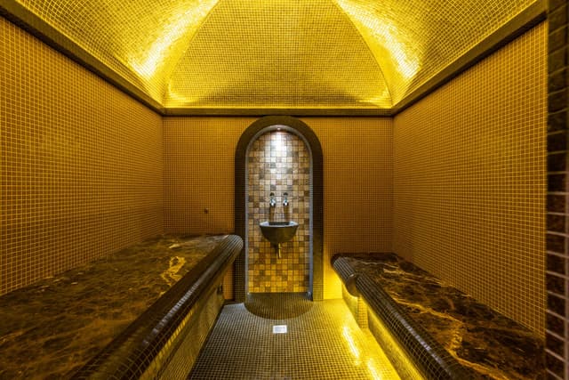 Room in a bathhouse with benches on either side